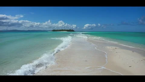 High tide on the sandbar between the islands Nosy Iranja. Madagascar.Anamorphic Stock Footage 323778898