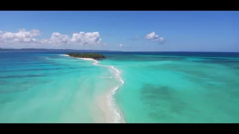 High tide on the sandbar between the islands Nosy Iranja. Madagascar.Anamorphic Stock Footage 323779385