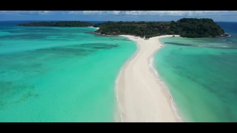 High tide on the sandbar between the islands Nosy Iranja. Madagascar.Anamorphic Stock Footage 323779839