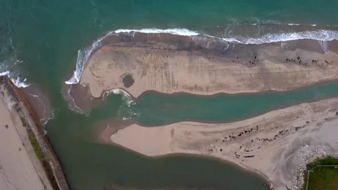 High up top down view of waves on the shore at high tide at Pentewan Cornwall Stock-Footage 260711623