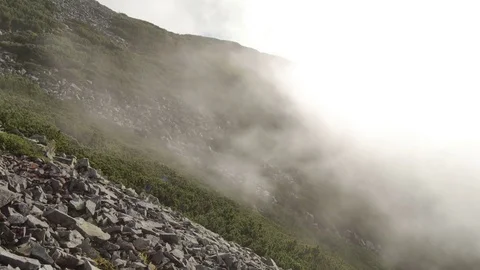 High top of the mountain with fast moving clouds. sunset after the rain. smooth Vídeos de archivo 77553695
