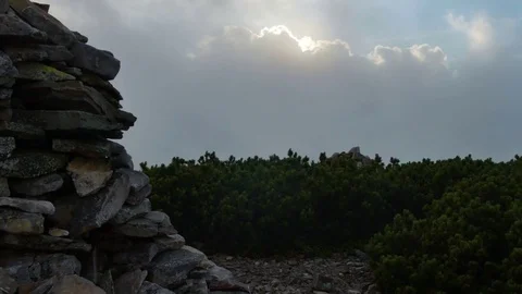 High top of the mountain with fast moving clouds. sunset after the rain. smooth Stock Footage 77554492