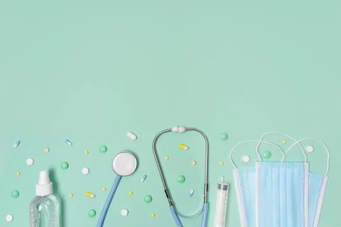 High top view background with stethoscope, syringe and pills. Stock Photos
