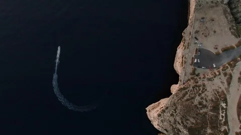 High Top View of a small boat by the Cliffs in Dingli Stock Footage 112868402