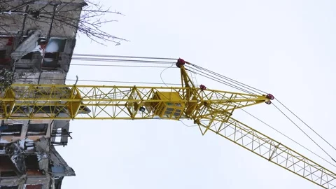 High tower crane with long boom at construction site. Stock Footage 258843639