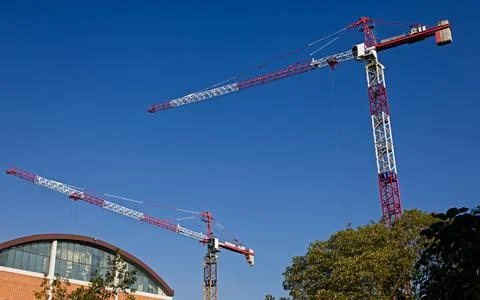 High tower cranes work on building site. Bologna, Italy, construction site Foto stock
