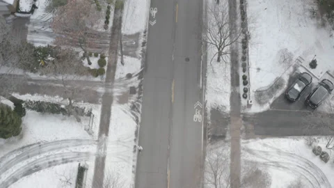 High tracking overhead aerial view of snowy Chicago neighborhood in winter Stock Footage 211223214