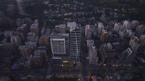 High twilight drone orbit around office tower Las Condes Santiago Chile Vídeos de archivo 334637402