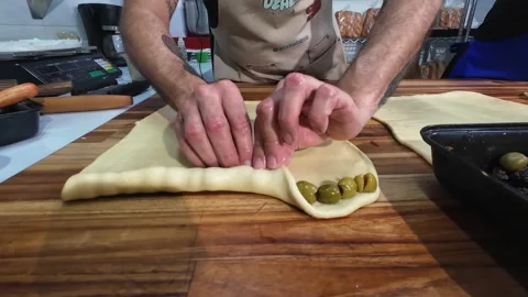 High Value Ingredients - Adding Olives To Costly Christmas Bread In Caracas Stock Footage 335435178
