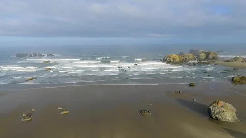 High vantage wide angle perspective of the rocky and sandy Pacific Ocean Stock Footage 119649157