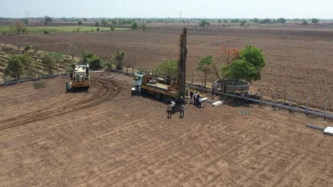 High vertical drone angle overlooking a specialized heavy-duty well drilling Stock Footage 337195424