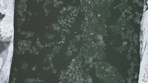 High vertical view of river icy flying past Stock Footage 327690842
