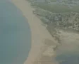 High view and pan down of distant empty beach SD Footage