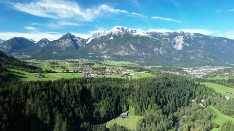 High view of a beautiful Austrian village surrounded by green landscape Stock Footage 174286239