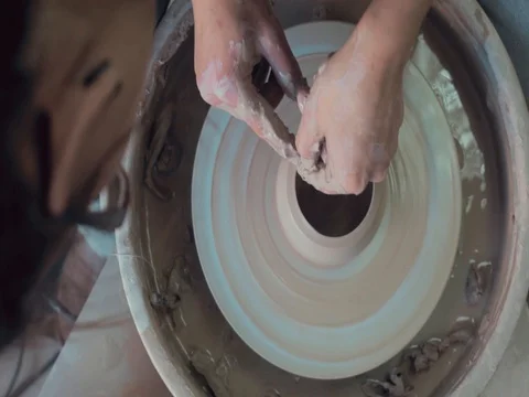 High view of Hands of Potter and A Spinning Pottery Wheel Stock-Footage 72279849