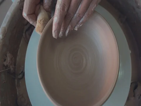 High view of Hands of Potter and A Spinning Pottery Wheel Stock Footage 72280413