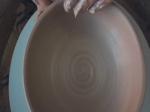 High view of Hands of Potter and A Spinning Pottery Wheel Stock Footage 72280424