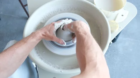 High View Of Hands Of Potter And A Spinning Pottery Wheel Vidéo 169227072