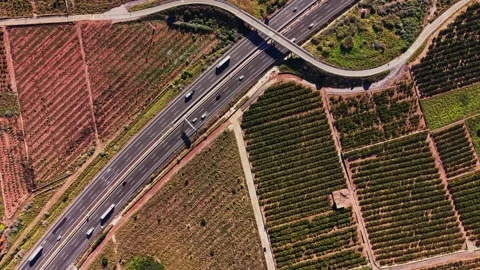 High view of highway crossing over fields in rural Spain Stock Footage 327643612