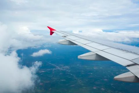 High view image through airplane window with nice clear blue sky Stock Photos