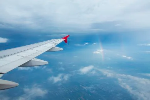 High view image through airplane window with nice clear blue sky Stock Photos
