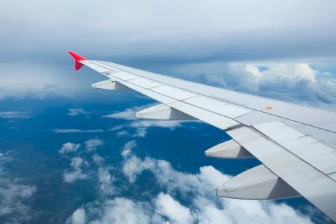 High view image through airplane window with nice clear blue sky Stock Photos