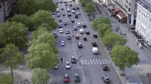 High view looking down trees cars driving two way traffic Champs-Elysees Paris Stock Footage 93928730