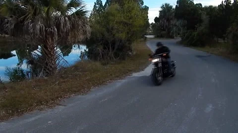 High view of motorcycle driving around corner Vídeos de archivo 45289606