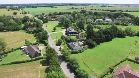 High view of multiple farm houses,trees and fields Drone Footage, 4K/25F Stock Footage 170485014