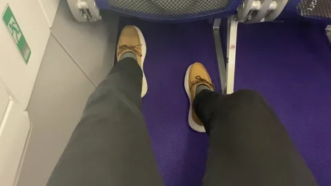 High view shot of persons knees having enough space for legs in airplane Stock-Footage 317302207