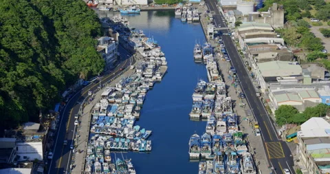 A high view from the sky of a small town beside the ocean. Stock Footage 213756499
