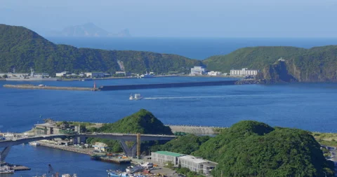 A high view from the sky of a small town beside the ocean. Stock Footage 213756546