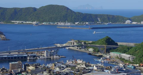 A high view from the sky of a small town beside the ocean. Stock Footage 213756587