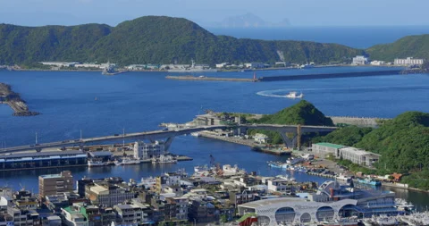 A high view from the sky of a small town beside the ocean. Stock Footage 213758260