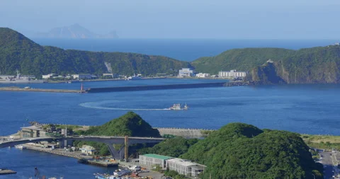 A high view from the sky of a small town beside the ocean. Stock Footage 213758630