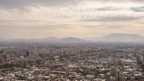 Up-high view time lapse panoramic view of cityscape and clouds running Stock Footage 140349076