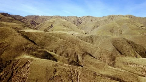 High view of valley with yellow mountain background, cloudy day, PEACEFULL Stock Footage 89869076