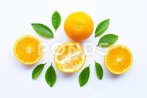 High vitamin C. Fresh orange citrus fruit with leaves isolated on white Stock Photos