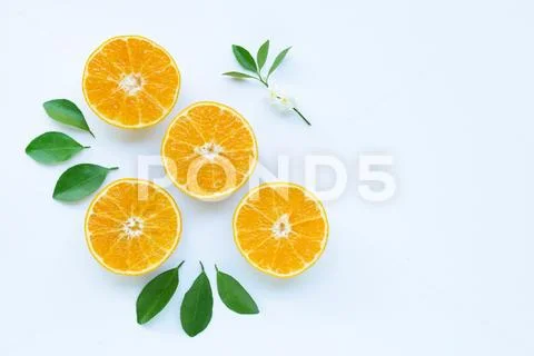 High vitamin C, Orange fruits with leaves on white background. Stock Photos