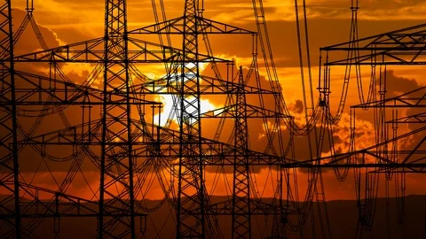 High Voltage Cable and Pylons, Time Lapse at Sunset with Red Sun Stock Footage 122368445
