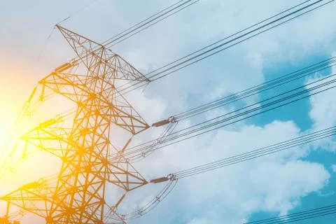 High voltage cable power post steel tower pylons in sunset scene twilight v.. Stock Photos