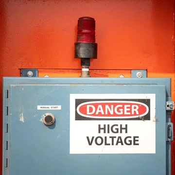 High Voltage caution sing on the power junction box. Stock Photos