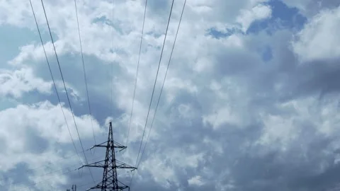 High-Voltage Electric Pole and Beautiful Time Lapse of Plump Cumulus Transformin Video stock 150497050
