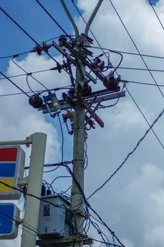 High voltage electric power lines on the sky background Stock Photos