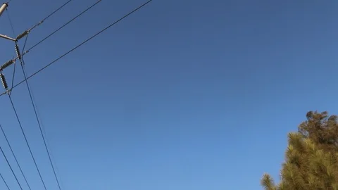 High Voltage Electric Tower with Blue Sky in the Background. Stock Footage 86658508