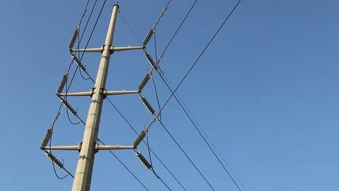High Voltage Electric Tower with Blue Sky in the Background. Stock Footage 86658621