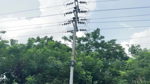 High Voltage Electric Utility Pole with Power Lines Against Cloudy Sky Video stock 339266952