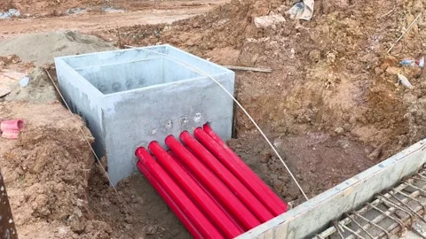 High Voltage Electrical Cable HDPE Pipe Installation in Construction Trench Stock Footage 340986051