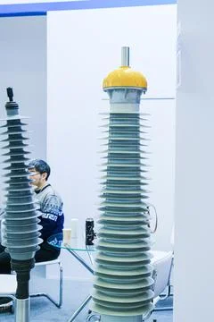 High voltage electrical insulator displayed at an industrial exhibition. Asia Stockfoto's