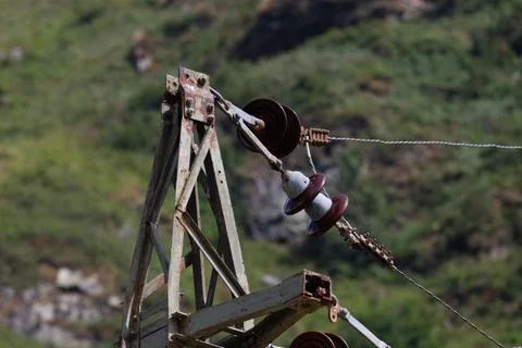 High Voltage Electrical Insulator on Pylon Close Up Stock Photos